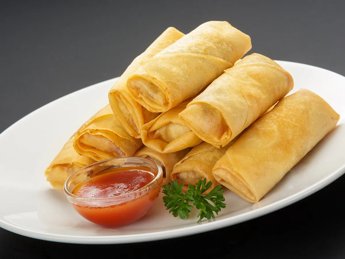 Crispy fried spring rolls served with sweet chili dipping sauce at China Wok Fast Food, a Chinese Restaurant in Hacienda Heights