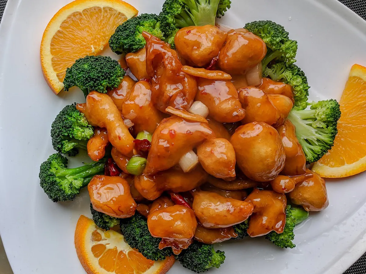 Sweet orange glazed chicken with fresh broccoli and orange slices at China Wok Fast Food, a Chinese Restaurant in Hacienda Heights